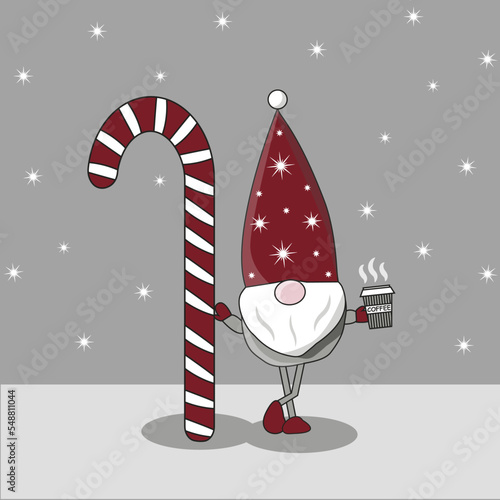 New Year. Christmas. santa claus elf stands leaning on a New Year lollipop or candy and holds hot coffee in his hand 