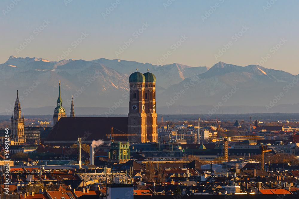 Frauenkirche against alpine panorama in Munich, Germany