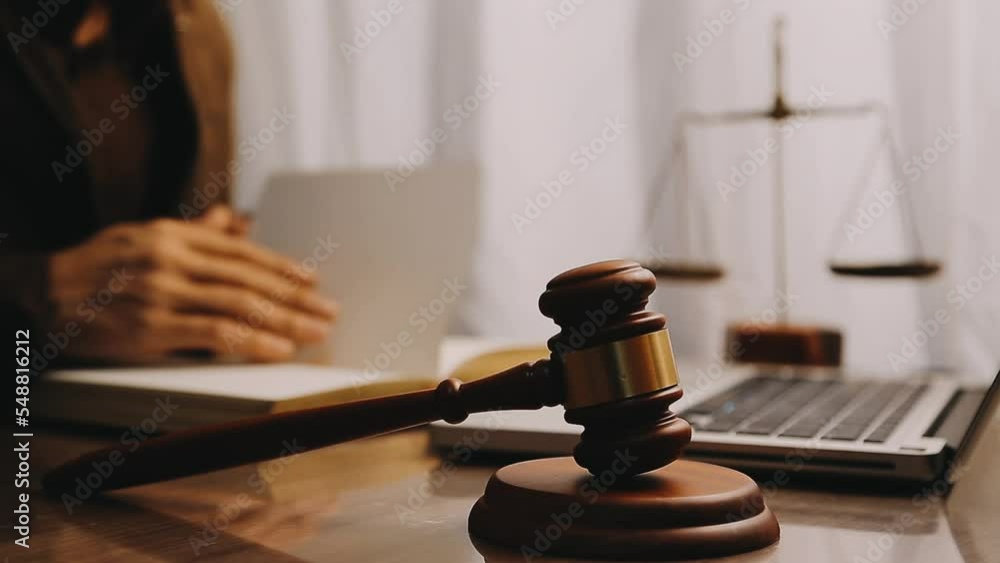 justice and law concept.Male judge in a courtroom on wooden table and Counselor or Male lawyer working in office. Legal law, advice and justice concept. justice and law concept.Male judge in a courtroom on wooden table and Counselor or Male lawyer working in office. Legal law, advice and justice concept.