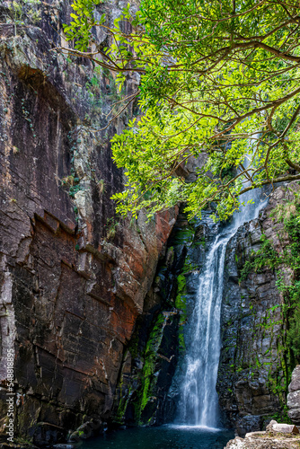 Waterfall between rocks with moss and preserved vegetation in Serra do Cipo in Minas Gerias photo