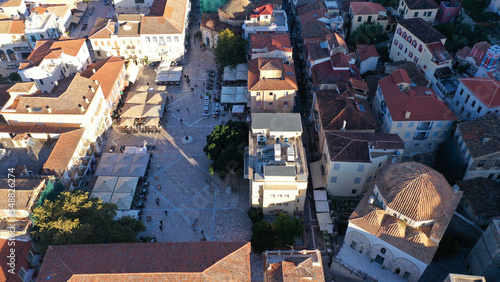 Aerial drone photo of picturesque rooftops and narrow streets in seaside old town in city of Nafplio  Argolida  Peloponnese  Greece