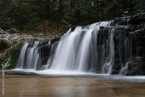 Waterfall in the winter forest in Roztocze. © Adam Sadlak