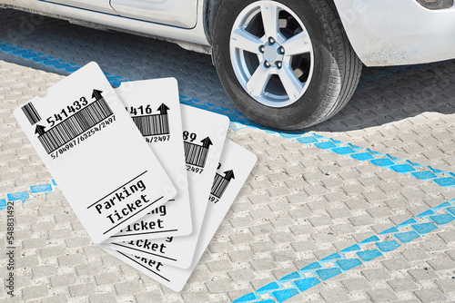 Parking payment concept with parked car and parking tickets