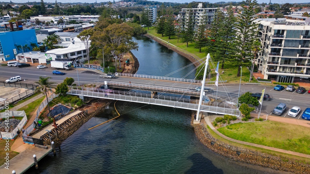 Naklejka premium Aerial view of the bridge and streets of Port Macquarie on a sunny day in NSW, Australia