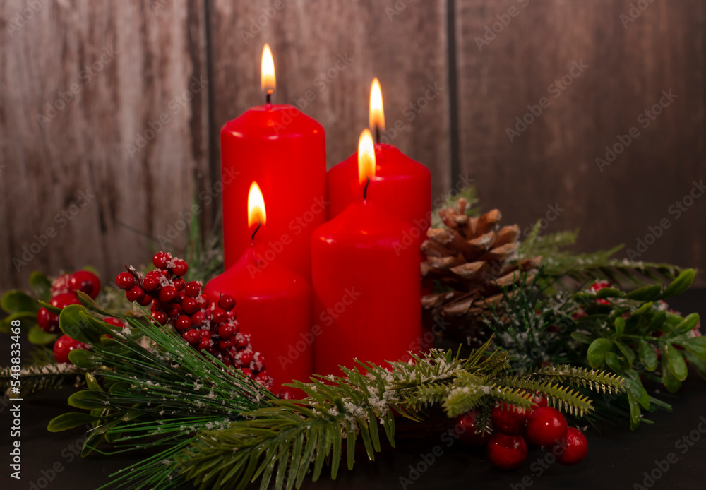 Advent - four red candles with a Christmas ornament. Fourth candle, Angel's candle