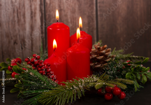 Advent - four red candles with a Christmas ornament. Fourth candle  Angel s candle