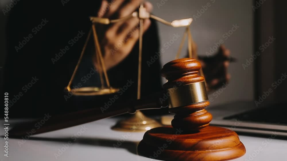 Business and lawyers discussing contract papers with brass scale on desk in office. Law, legal services, advice, justice and law concept picture with film grain effect Business and lawyers discussing contract papers with brass scale on desk in office. Law, legal services, advice, justice and law concept picture with film grain effect