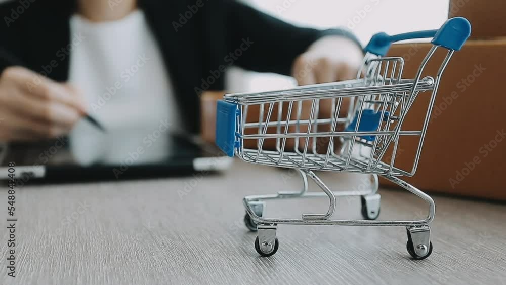 Business woman start up small business entrepreneur SME success .freelance woman working at home with Online Parcel delivery. SME and packaging deliveryconcept Business woman start up small business entrepreneur SME success .freelance woman working at home with Online Parcel delivery. SME and packaging deliveryconcept