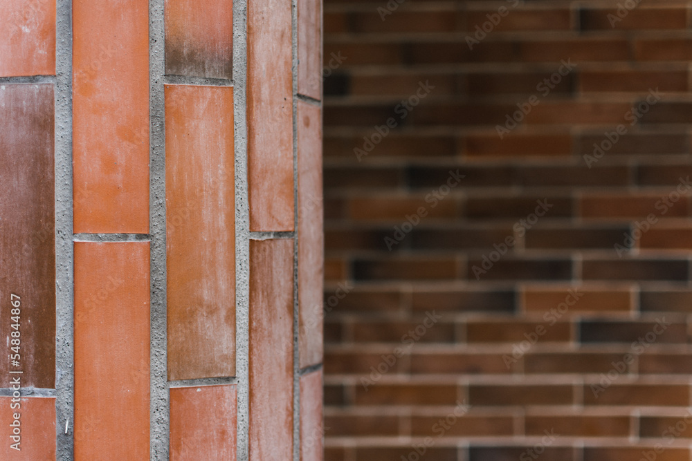 Pillar and wall made of red brick stones. Architecture background or backdrop
