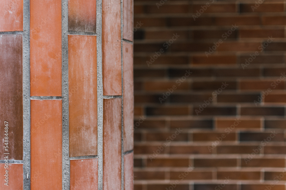 Pillar and wall made of red brick stones. Architecture background or backdrop Pillar and wall made of red brick stones. Architecture background or backdrop