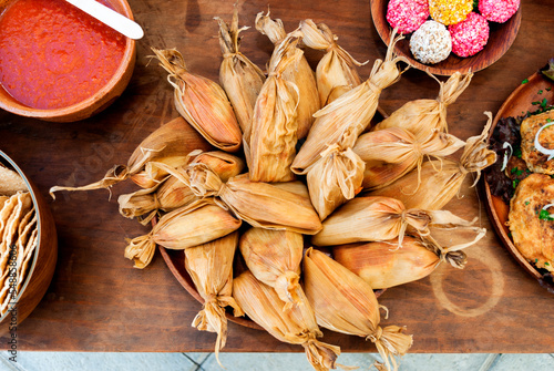 Small tamales called Chuchitos, typical Guatemalan food, made of corn dough and meat with a sauce called recado, traditional diet.