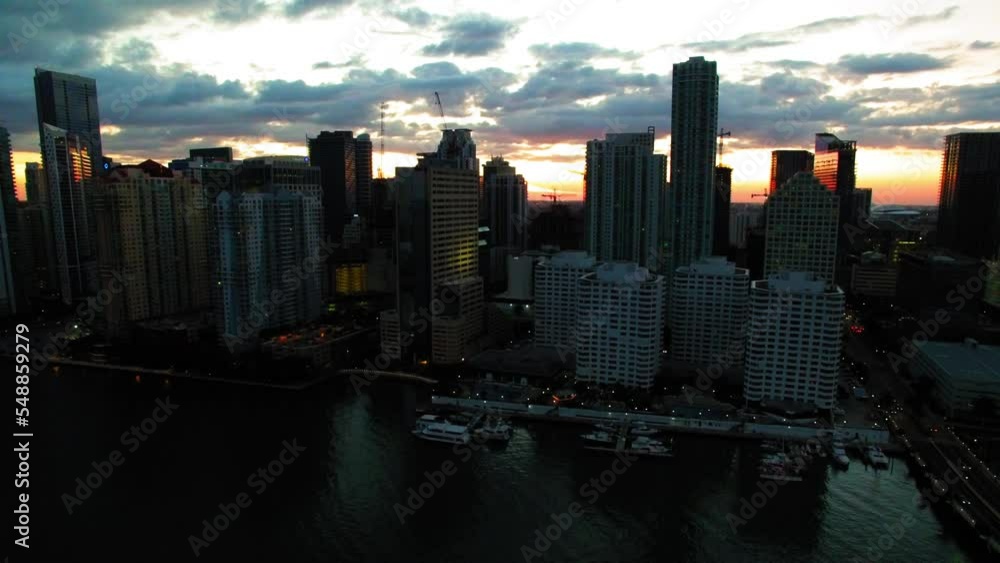 Aerial Shot Of Nautical Vessels By Hotel Towers In Downtown, Drone Flying Downwards Over Sea During Sunset - Miami, Florida Aerial Shot Of Nautical Vessels By Hotel Towers In Downtown, Drone Flying Downwards Over Sea During Sunset - Miami, Florida
