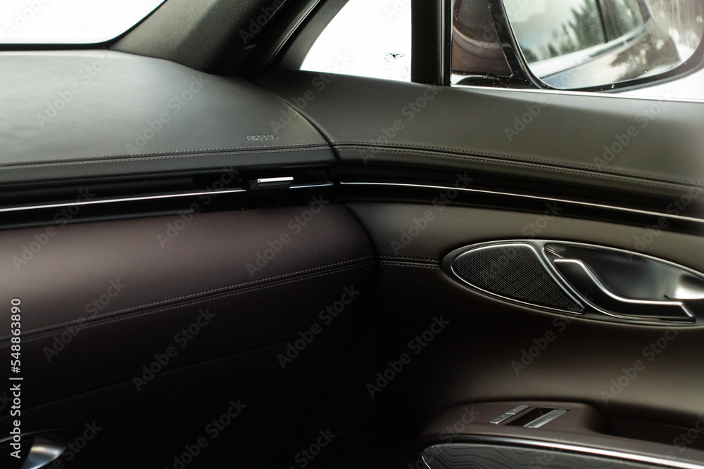 Modern car leather interior details with stitch. Car interior details.