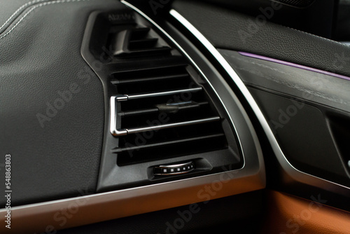 Car air conditioning close up view. The air conditioner flow inside the car. Detail interior of car. Air ducts.