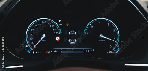 TPMS (Tyre Pressure Monitoring System) with temperature measurement monitoring. Modern digital car dashboard close up.