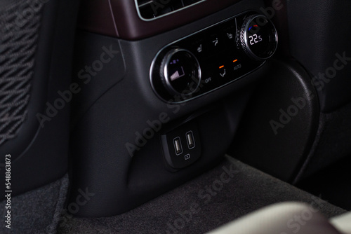Opened car USB port in the car for connecting device. Power output of usb charger close up view. Car interior. © Roman