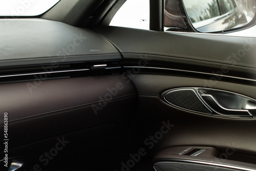 Modern car leather interior details with stitch. Car interior details. © Roman