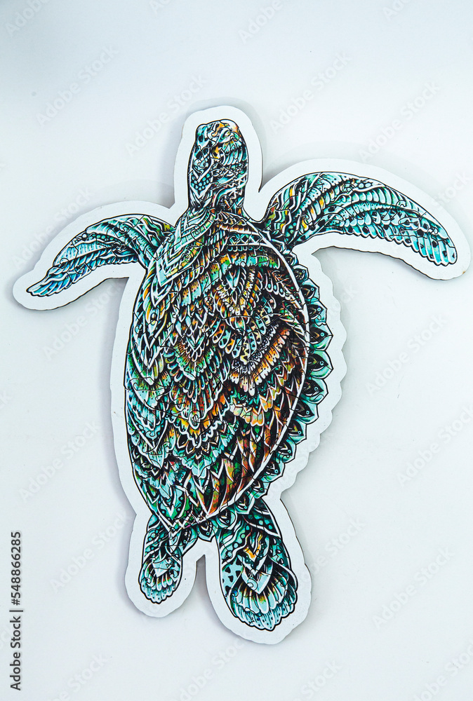 Fototapeta premium Wooden puzzle for children and adults on a white background. View from above. vertical orientation