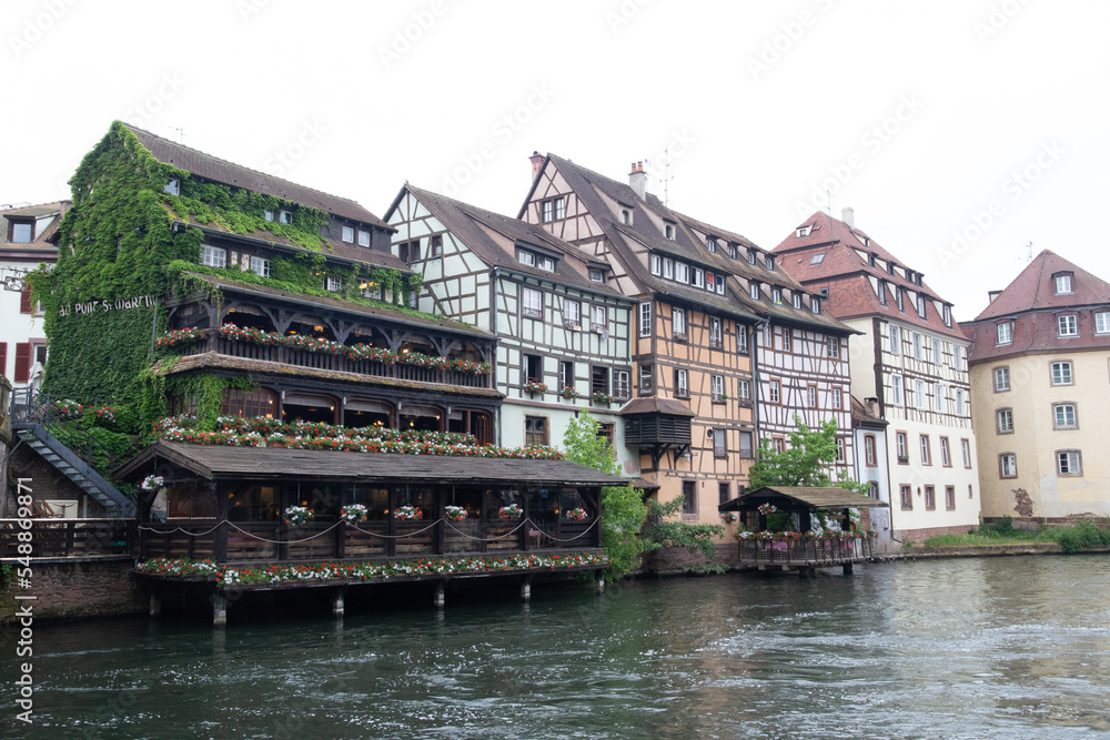 Colored houses in a French village along a canal in the Alsace area