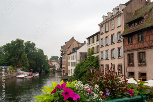 Colored houses in a French village along a canal in the Alsace area