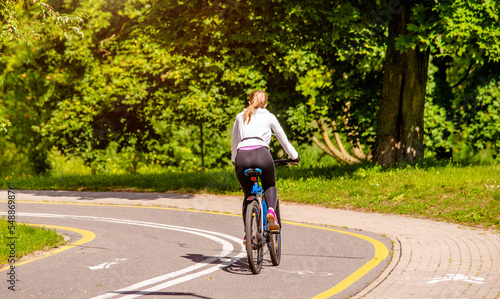 Wallpaper Mural Cyclist ride on the bike path in the city Park
 Torontodigital.ca