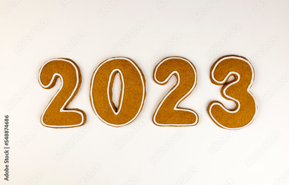The numbers 2023 are made of gingerbread, on a white background. The numbers 2023 are made of gingerbread, on a white background.