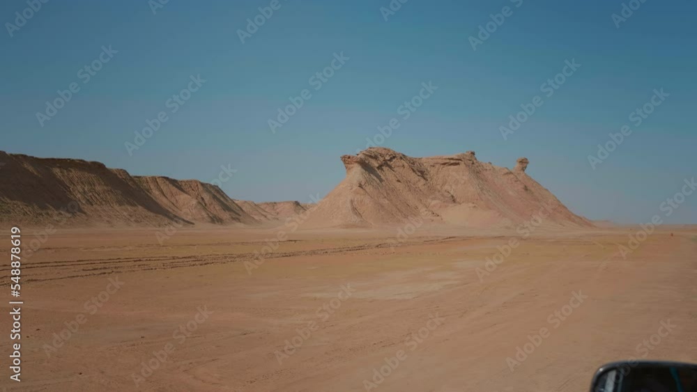 Off road tourists exploration of deserted sahara admiring dune. Non populated areas of Africa panoramic sand hills. Holiday concept ideas. Off road tourists exploration of deserted sahara admiring dune. Non populated areas of Africa panoramic sand hills. Holiday concept ideas.