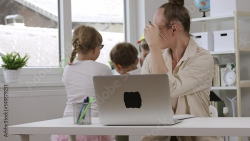 Young mother is working at laptop. Homeoffice
