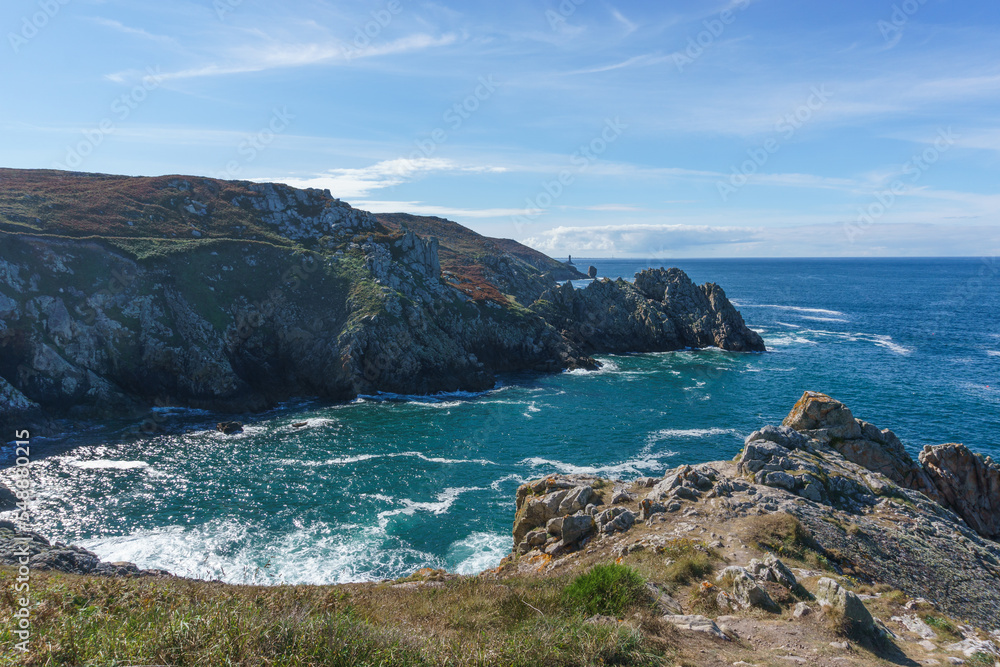 Coastline with hiking path and view to Pointe du Raz and Vieille lighthouse, Plogoff, Finistere, Brittany, France