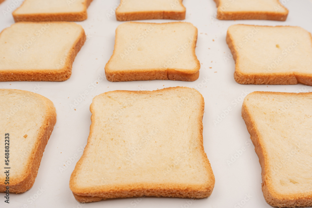 Delicious bread slices isolated on a white background, top view. Delicious bread slices isolated on a white background, top view.