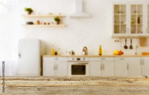 Wood table shelf on blur cooking kitchen background.For montage product display or design key visual layout.Kitchen and cooking concept.View of copy space. © TE
