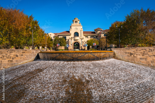 Temecula City Hall building over water fountain with Christmas Greetings on a bright sunny autumn day with blue sky in Southern California, USA
