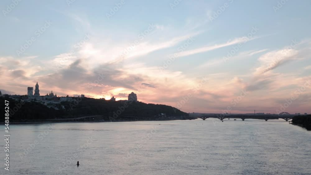 Top Aerial view Colored evening summer sky. sailing motor boat with angler on Dnipro river at sunrise sunset. landscape of bridge over lakes in Kiev Ukraine city. water transport, travel Top Aerial view Colored evening summer sky. sailing motor boat with angler on Dnipro river at sunrise sunset. landscape of bridge over lakes in Kiev Ukraine city. water transport, travel