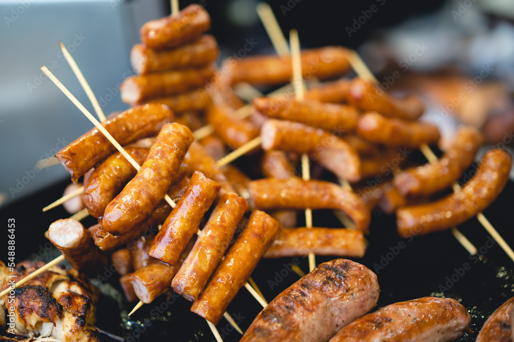 delicious grilled sausages on a stick