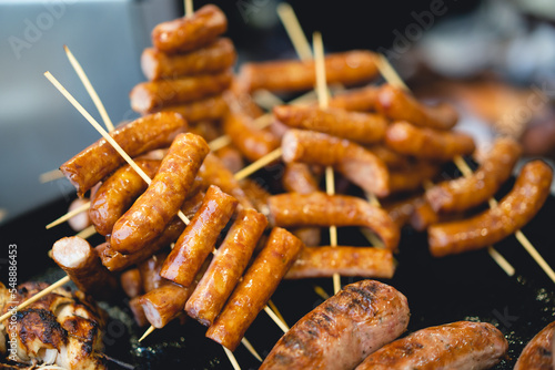 delicious grilled sausages on a stick