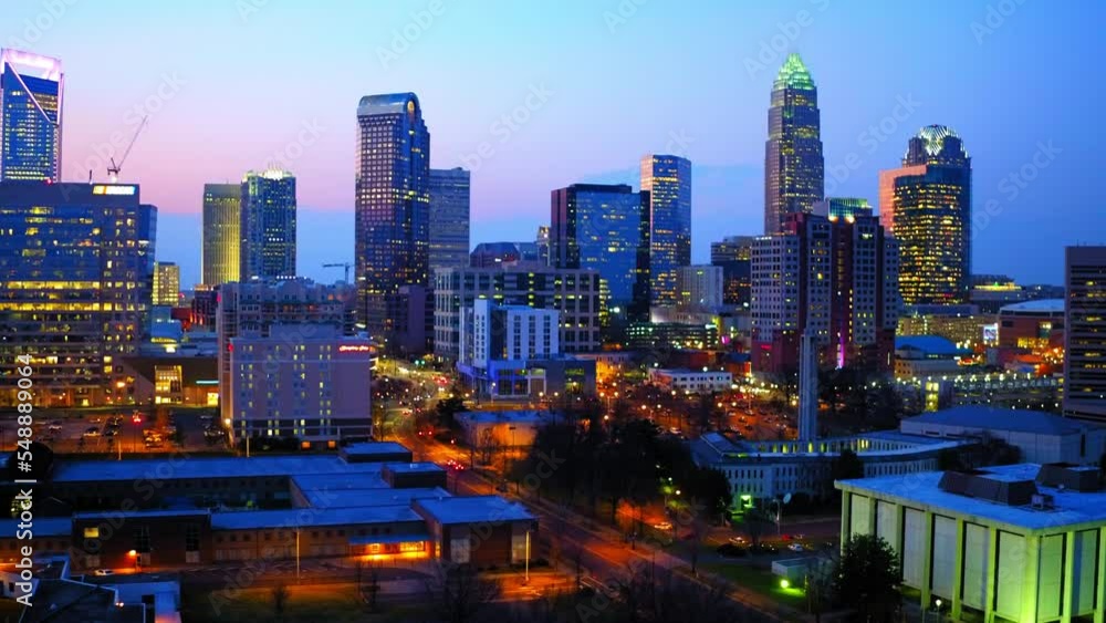 Aerial Shot Of Tall Office Towers Against Cloudy Sky, Drone Flying Forward Over City At Dusk - Charlotte, North Carolina Aerial Shot Of Tall Office Towers Against Cloudy Sky, Drone Flying Forward Over City At Dusk - Charlotte, North Carolina