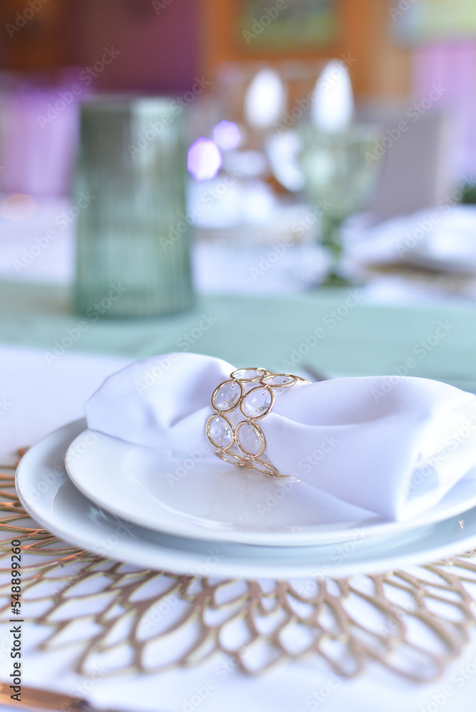 Serving and decoration of the wedding table. Glasses, spoons, forks and white napkins
Serving and decoration of the wedding table. Glasses, spoons, forks and white napkins