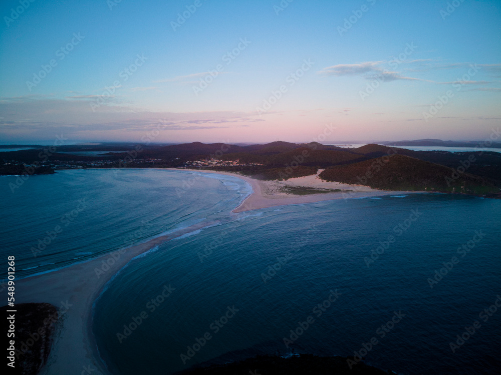Drone photo of Fingal Bay taken from the Fingal spit, just before sunrise