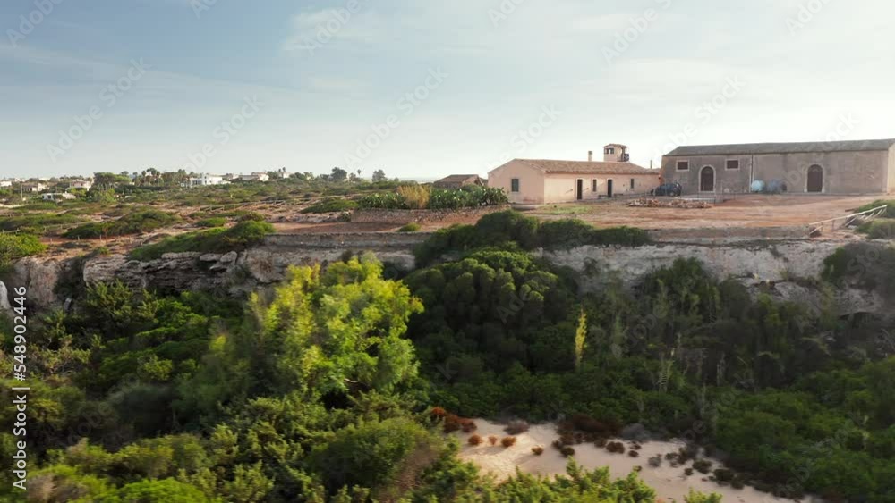 Exterior Of Casa Della Citadella By The Beach In Noto, Sicily, Italy. drone sideways Exterior Of Casa Della Citadella By The Beach In Noto, Sicily, Italy. drone sideways