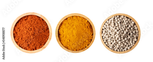 Crushed red chili pepper Turmeric powder Peppercorn in wood bowl on transparent png photo