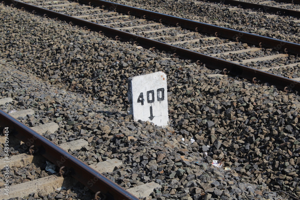 Railway lines with track ballast. Train tracks underlay, rails and crushed stones. Industrial landscape. Railway junction. Railway lines with track ballast. Train tracks underlay, rails and crushed stones. Industrial landscape. Railway junction.