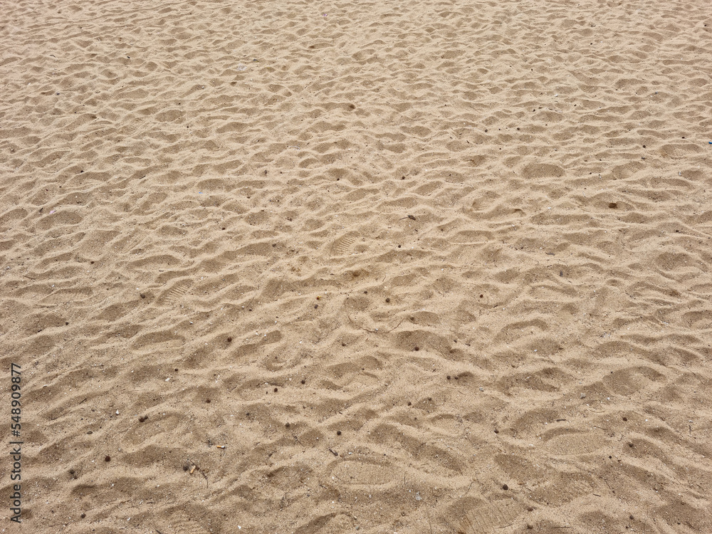 closeup of sand pattern of a beach in the summer closeup of sand pattern of a beach in the summer