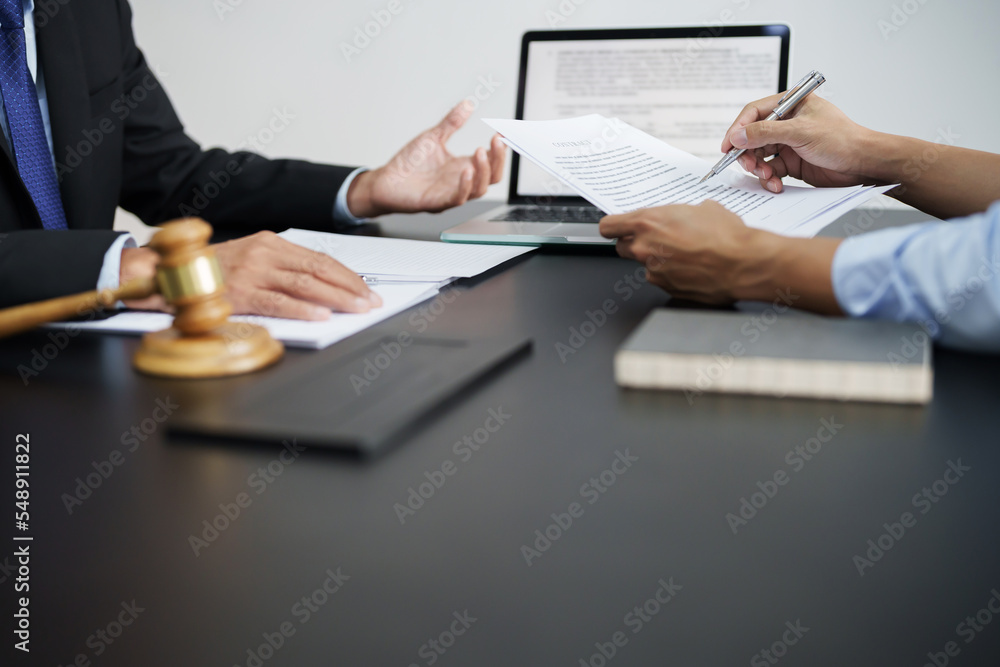 Lawyer with lawsuit meeting with client discussing with contract agreement at courtroom.. Lawyer with lawsuit meeting with client discussing with contract agreement at courtroom..