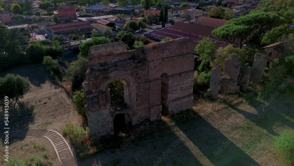 Ruins in archaeological park of Tor Fiscale on sunny day, Rome in Italy. Aerial drone descending Ruins in archaeological park of Tor Fiscale on sunny day, Rome in Italy. Aerial drone descending