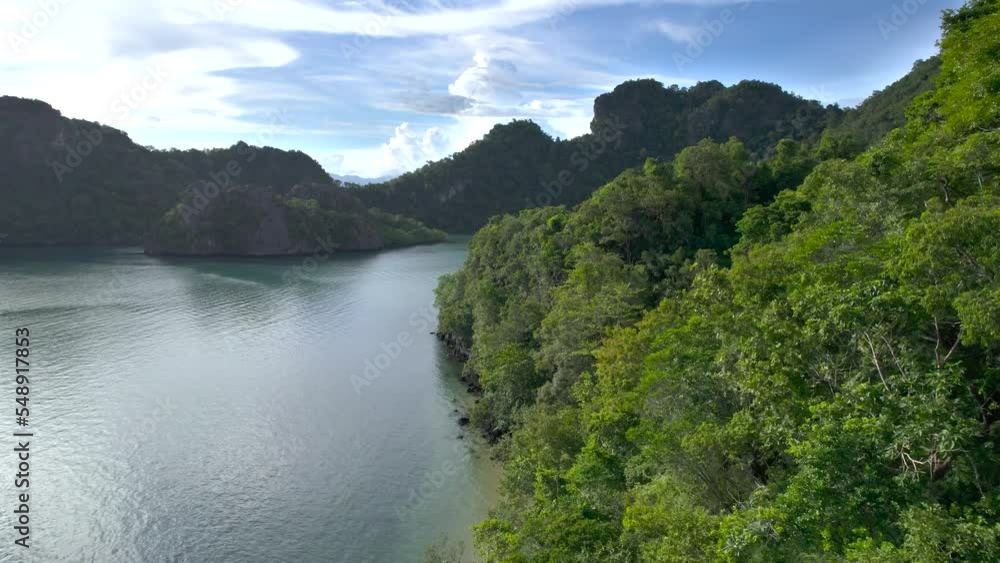 Tanjung Rhu Beach, Malaysia. Drone flight over coastline close to treetops. Tanjung Rhu Beach, Malaysia. Drone flight over coastline close to treetops.