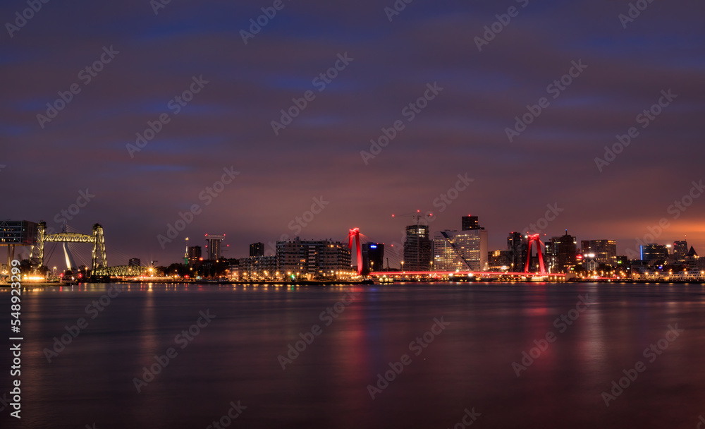 city skyline at night with river