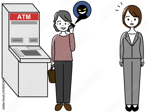 銀行ATMの前で詐欺師から電話で指示される高齢女性と、それを気にする銀行員の女性
