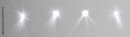 Set of spotlights isolated on transparent background. Vector glowing light effect with rays.