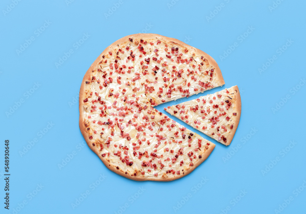Tarte flambee above view on a blue background Tarte flambee above view on a blue background