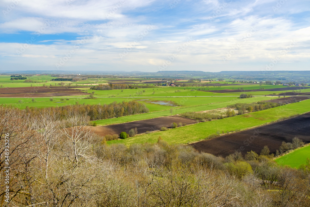 Scenic view over a agricultural landscape at spring